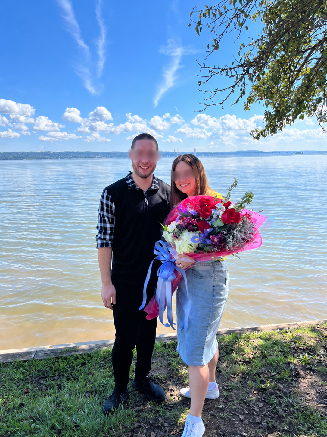 Celebrating a couple · by the water