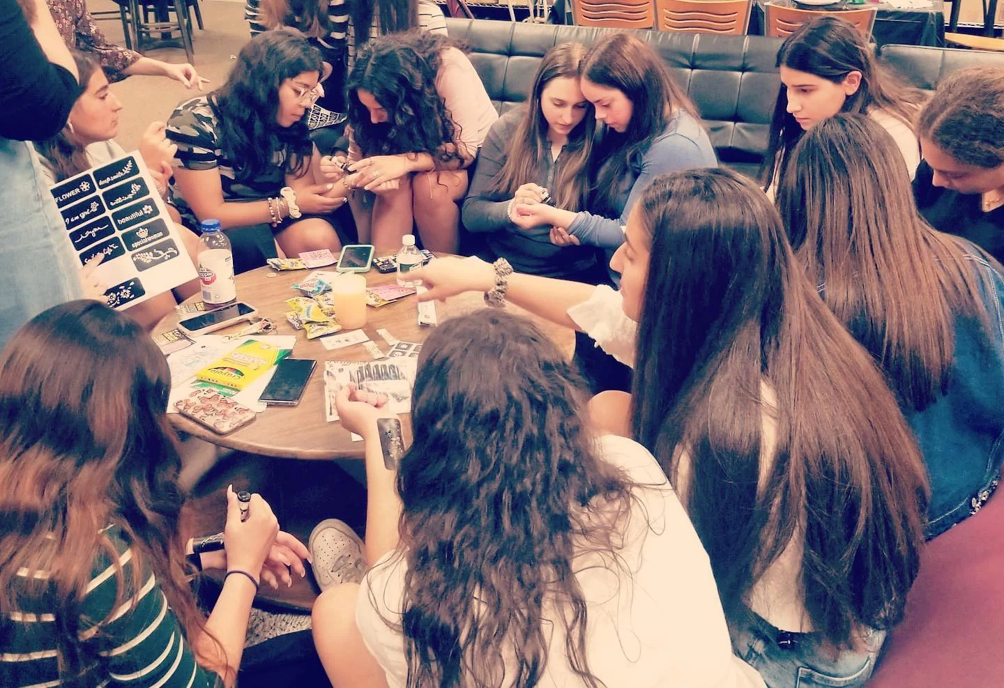 Members sharing a meal around the Lighthouse table