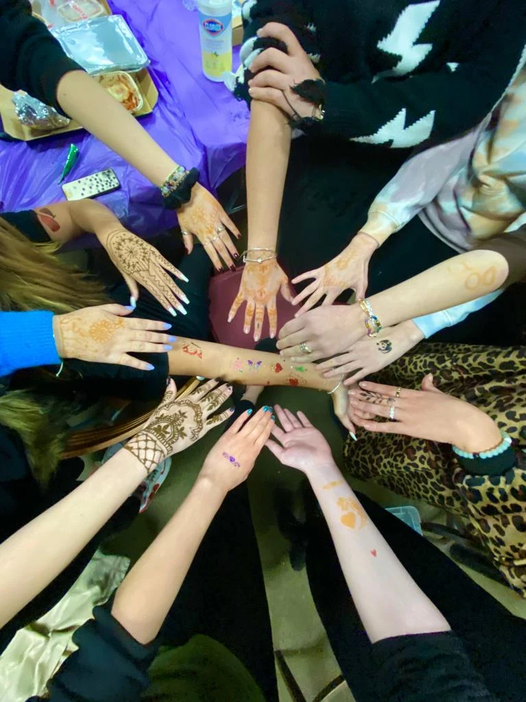 Lighthouse members joining hands in a circle